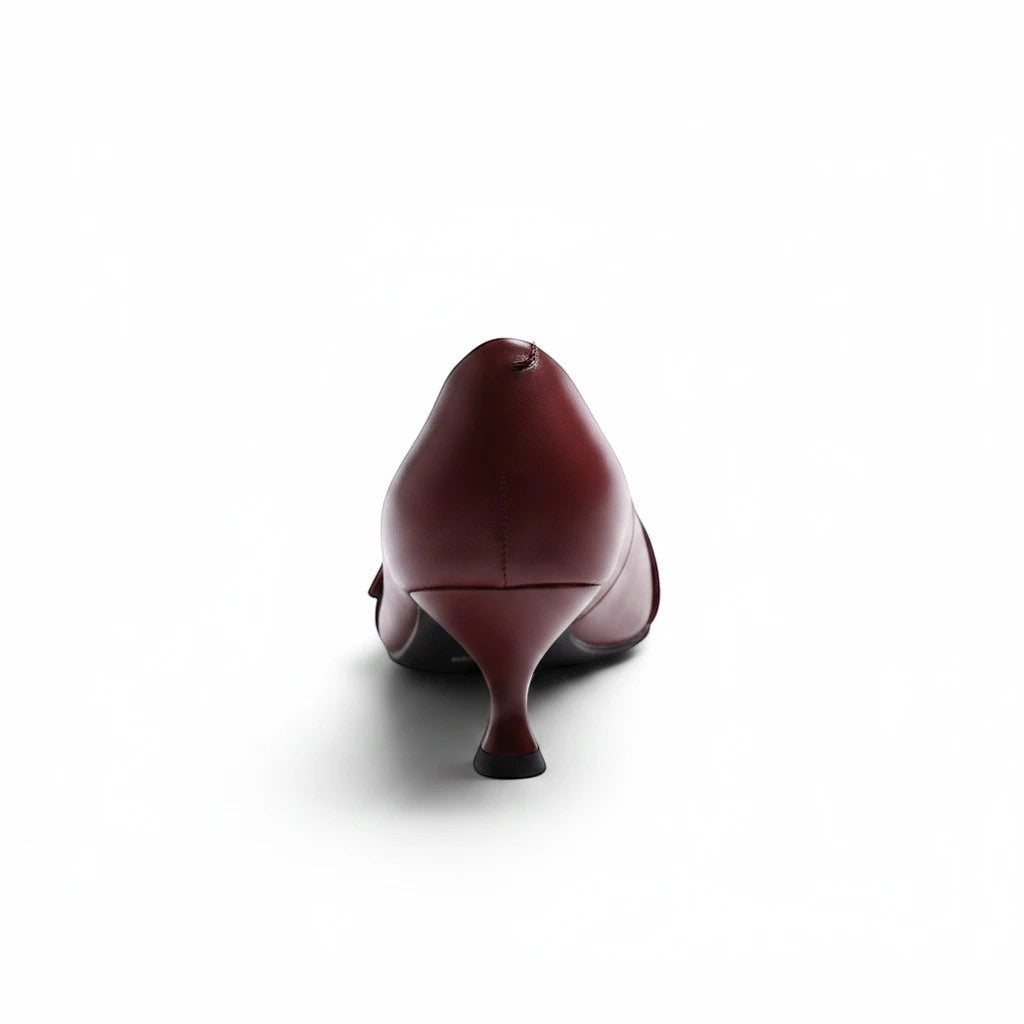 Moda Ug burgundy faux leather kitten heel pumps with pointed toe and buckle strap.