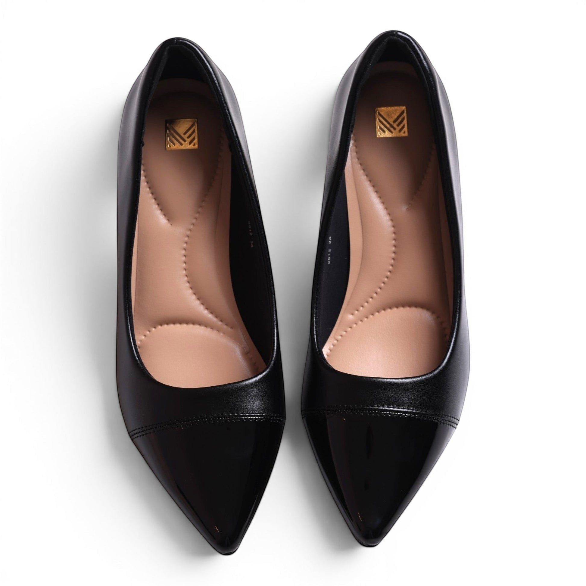 Moda Ug black pointed-toe ballet flats with patent toe cap and cushioned insole.