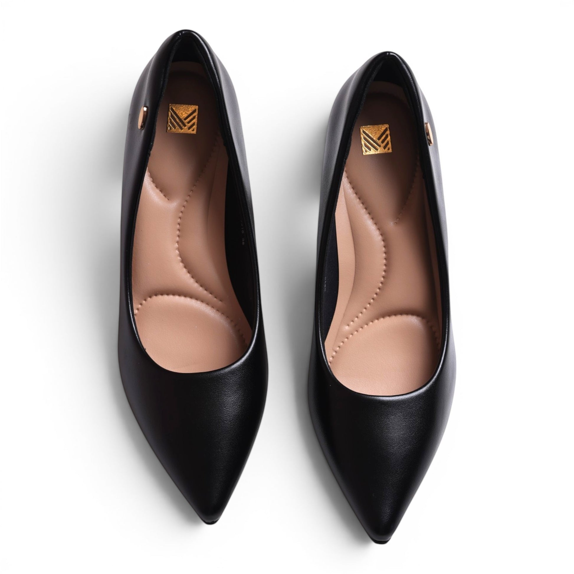 Moda Ug black leather pointed-toe pumps with cushioned insoles and gold logo detail.