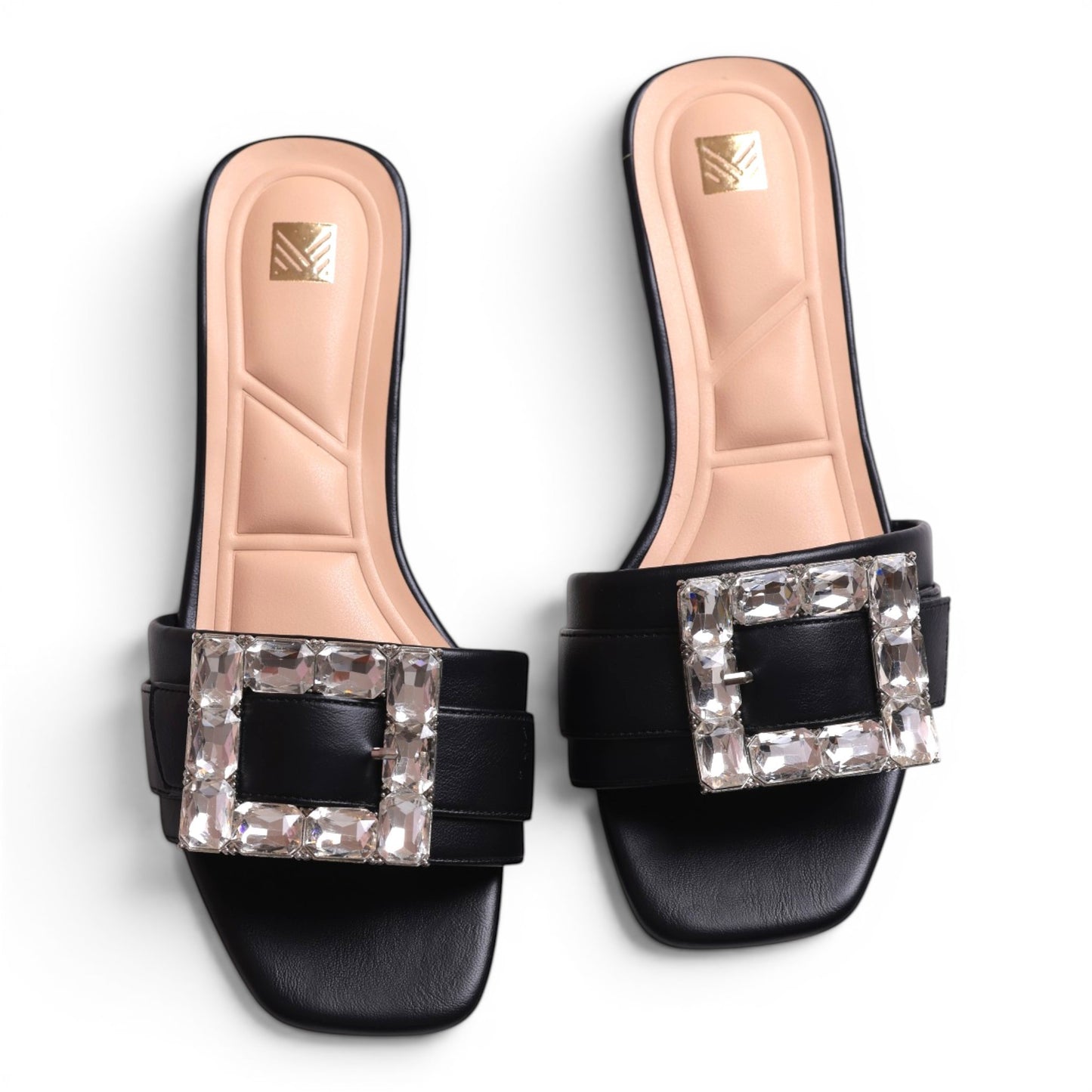Moda Ug black leather slide sandals with square crystal embellishments and padded insoles.