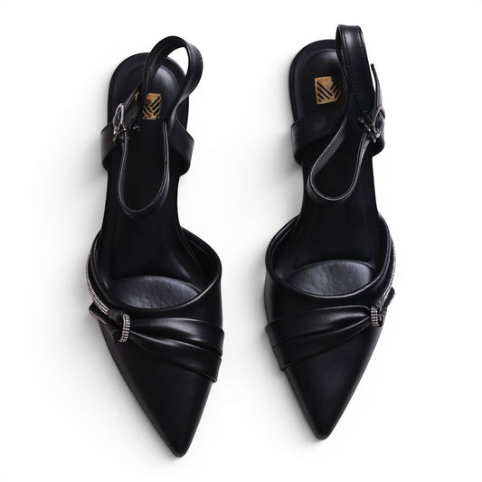 Moda Ug black leather pointed-toe slingback heels with knotted detail and crystal embellishments.