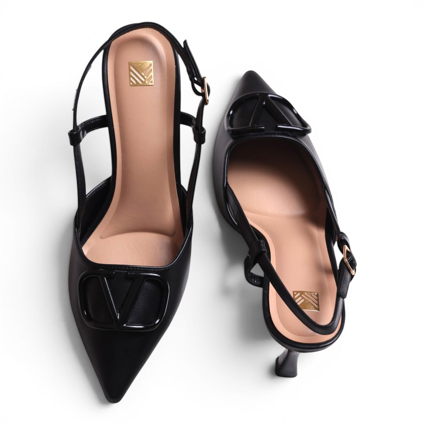Moda Ug black leather slingback pointed-toe heels with V logo detail and adjustable ankle strap.