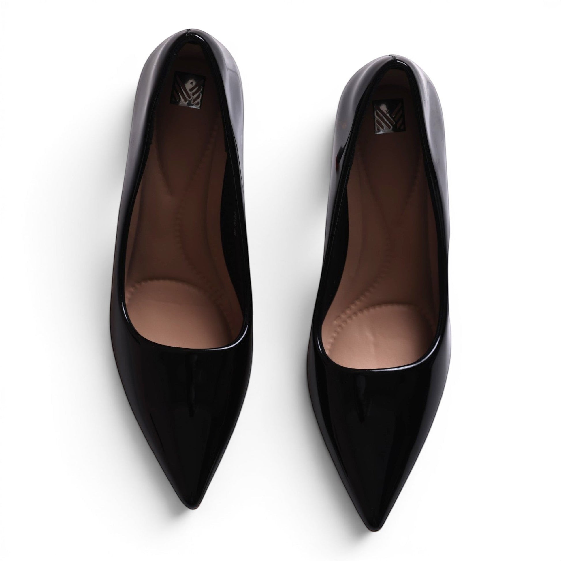 Moda Ug black patent leather pointed-toe ballet flats with cushioned insoles.