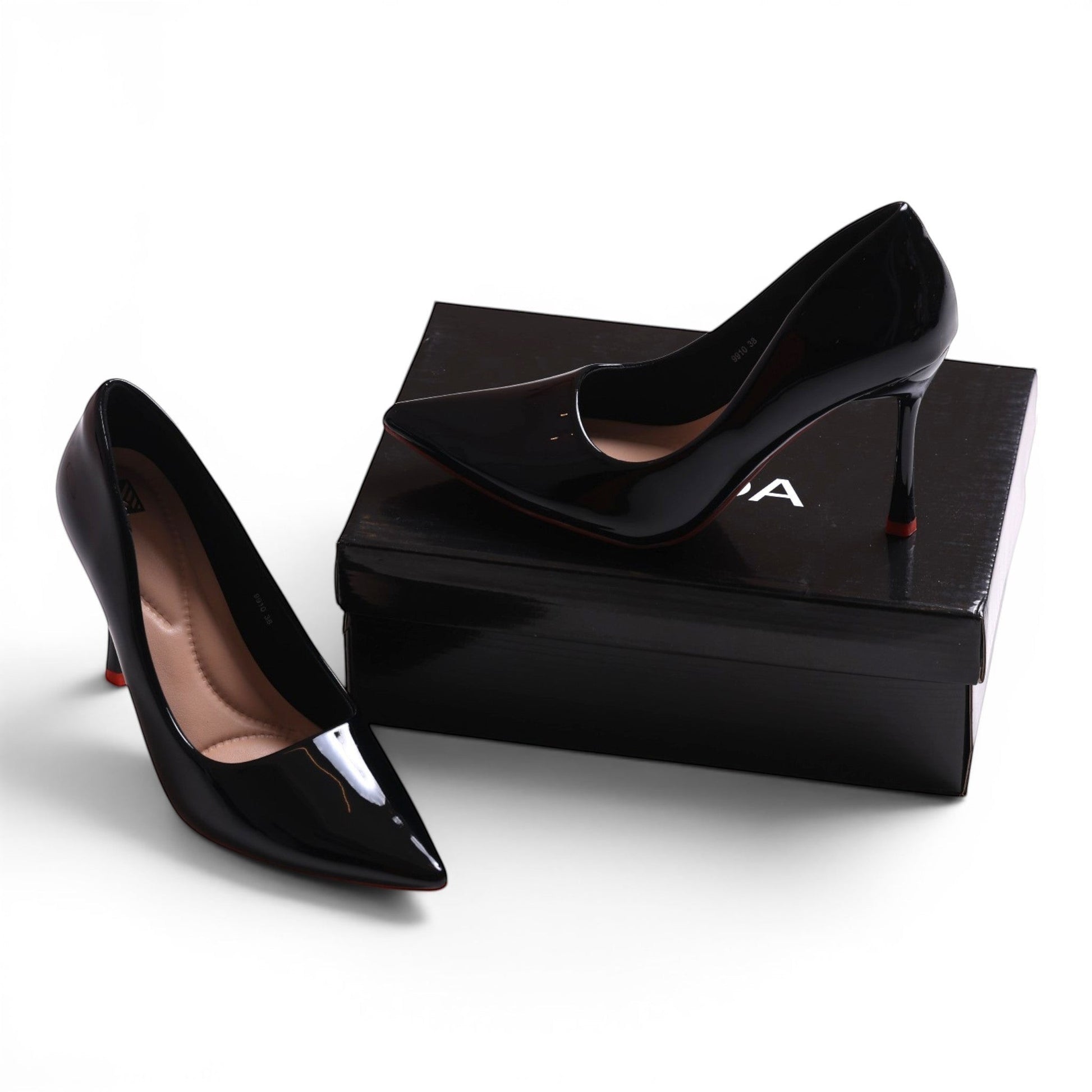 Moda Ug black patent leather pointed toe high heel pumps with cushioned insoles.