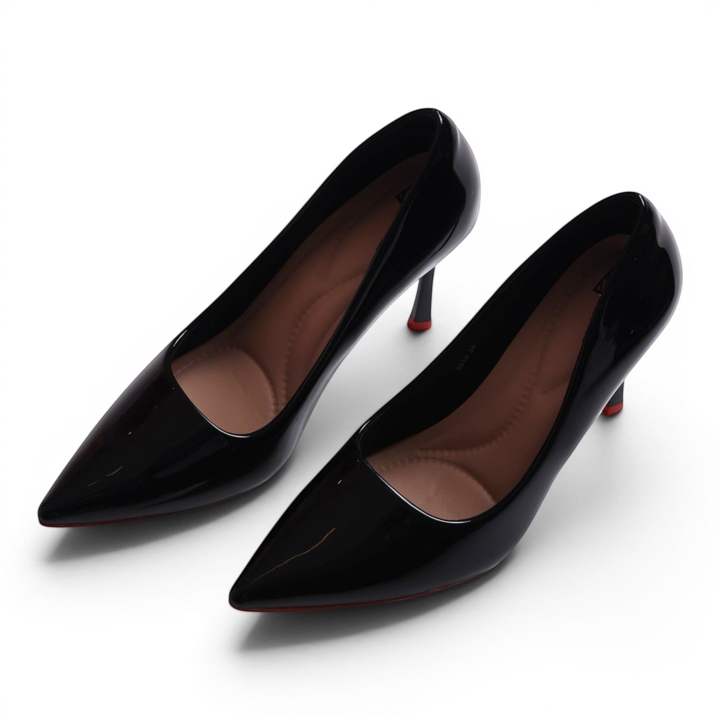 Moda Ug black patent leather pointed-toe pumps with a stiletto heel and red sole detail.