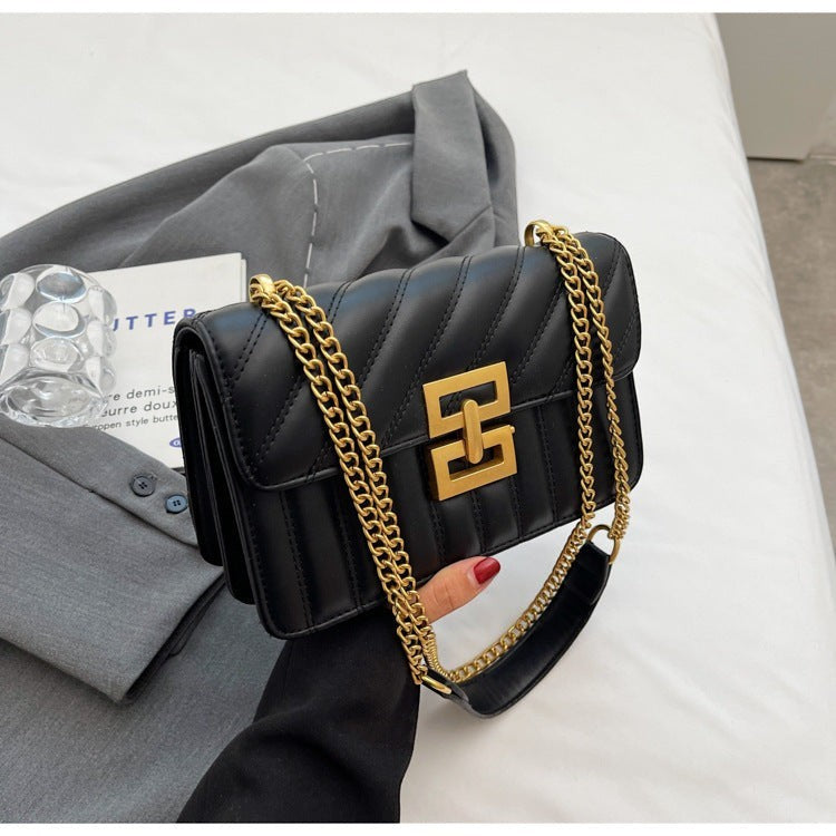 Moda Ug black PU leather small square crossbody handbag with quilted rhombic pattern and gold chain strap.
