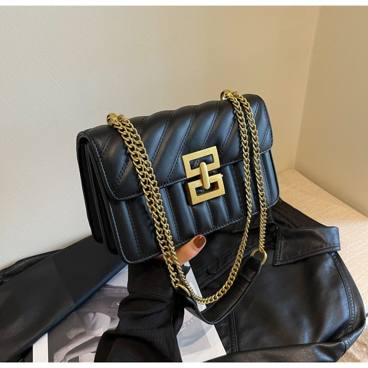 Moda Ug black PU leather small square crossbody handbag with quilted rhombic pattern and gold chain strap.