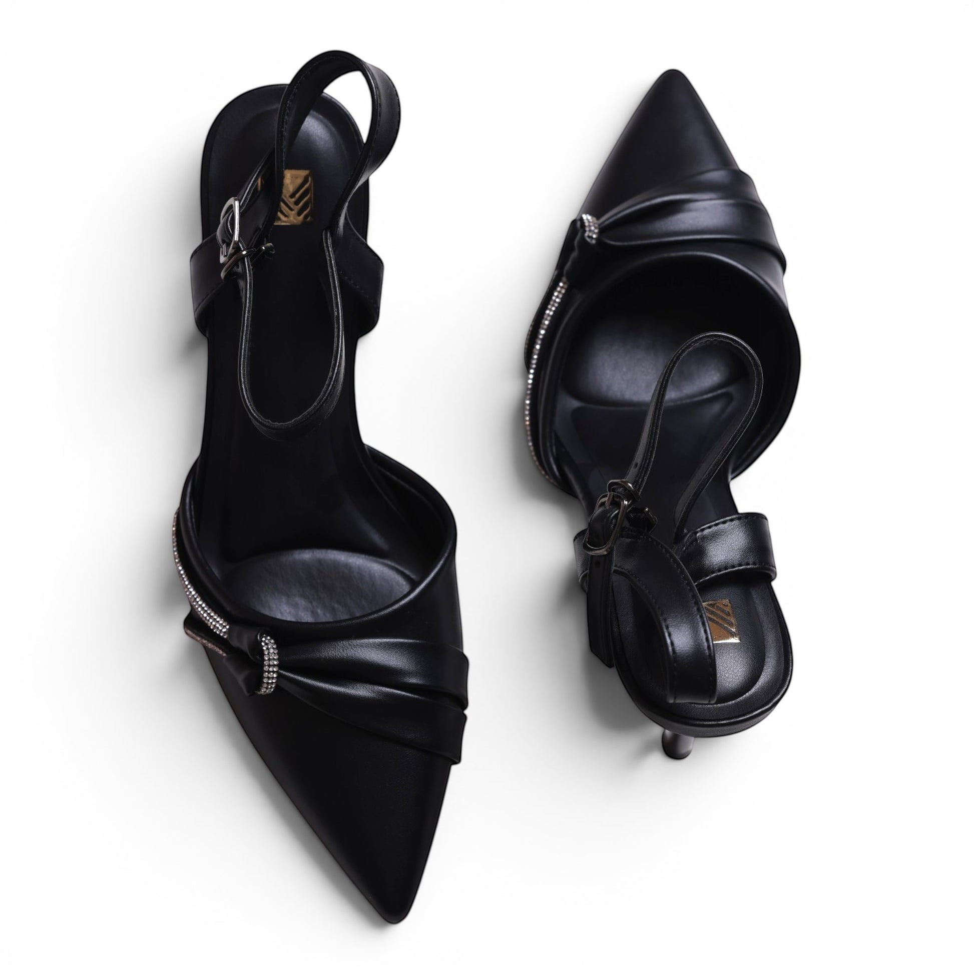 Moda Ug black pointed-toe slingback heels with rhinestone embellishments and buckle strap.