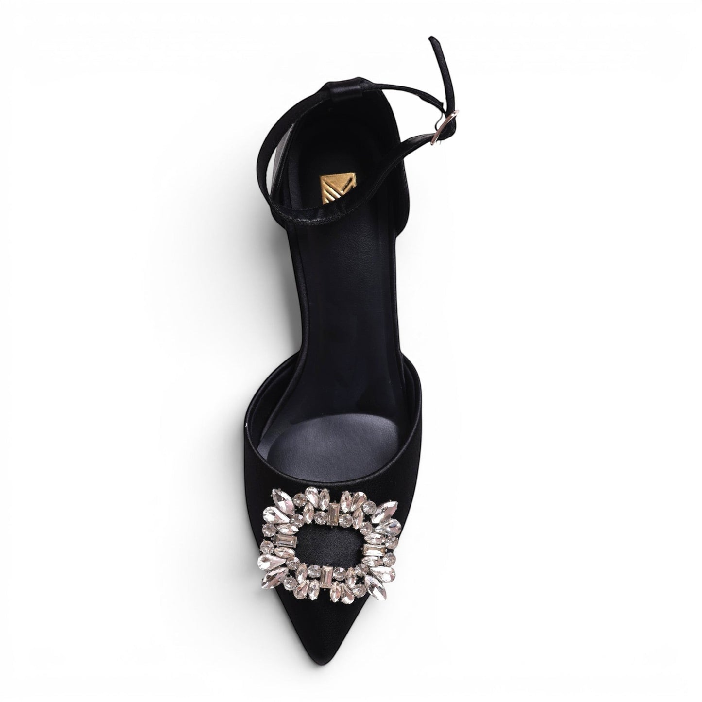 Moda Ug black satin pointed-toe pump with ankle strap and crystal buckle detail.