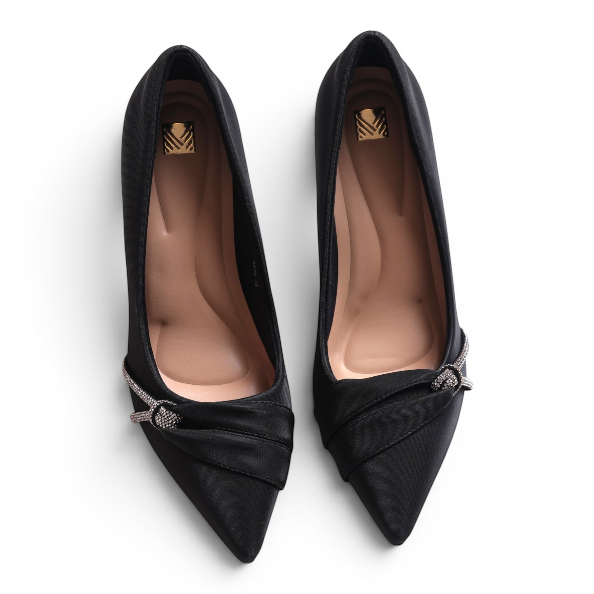 Moda Ug black satin pointed-toe pumps with crystal embellishment and a low heel.