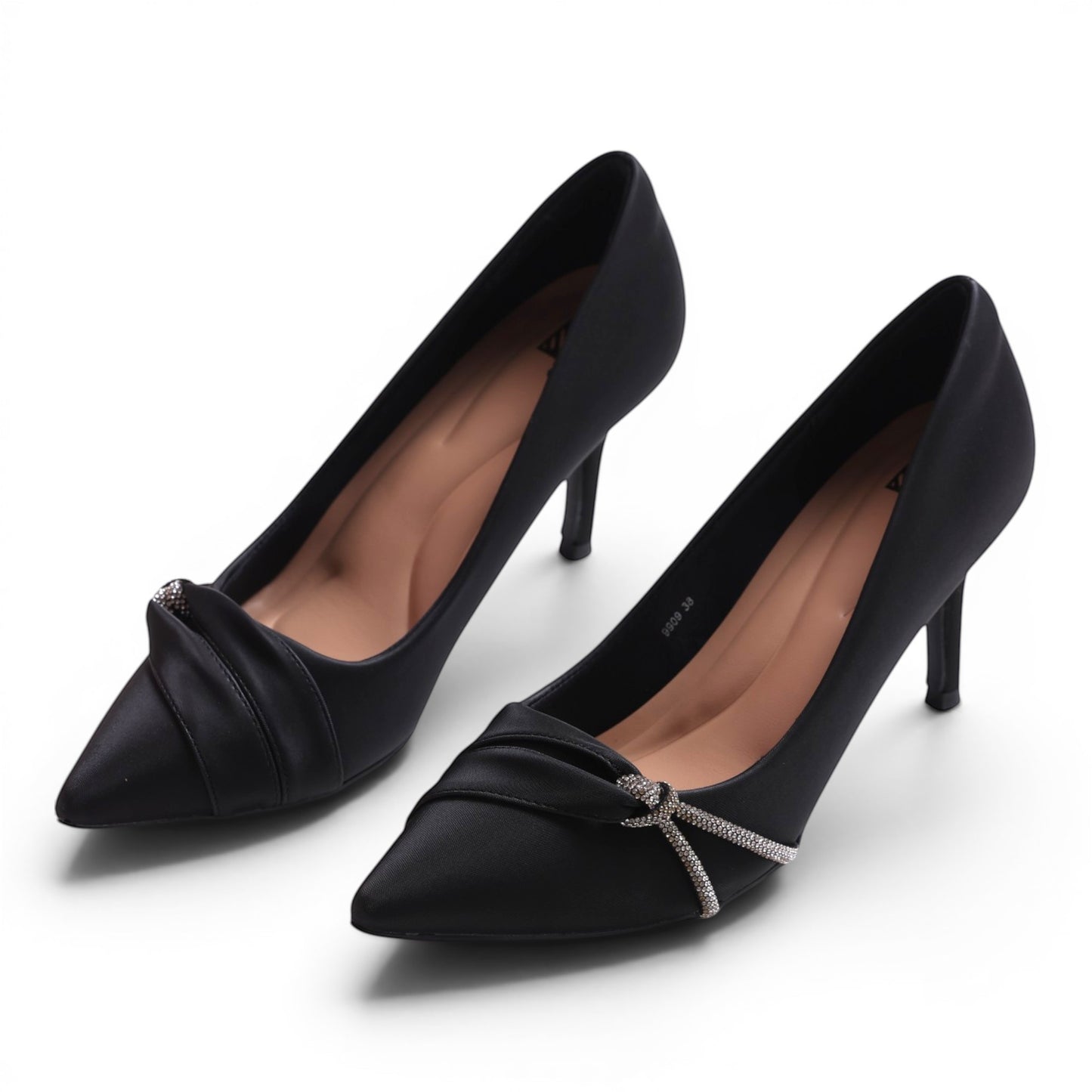 Moda Ug black satin pointed-toe pumps with ruched detail and crystal embellishment on the toe.