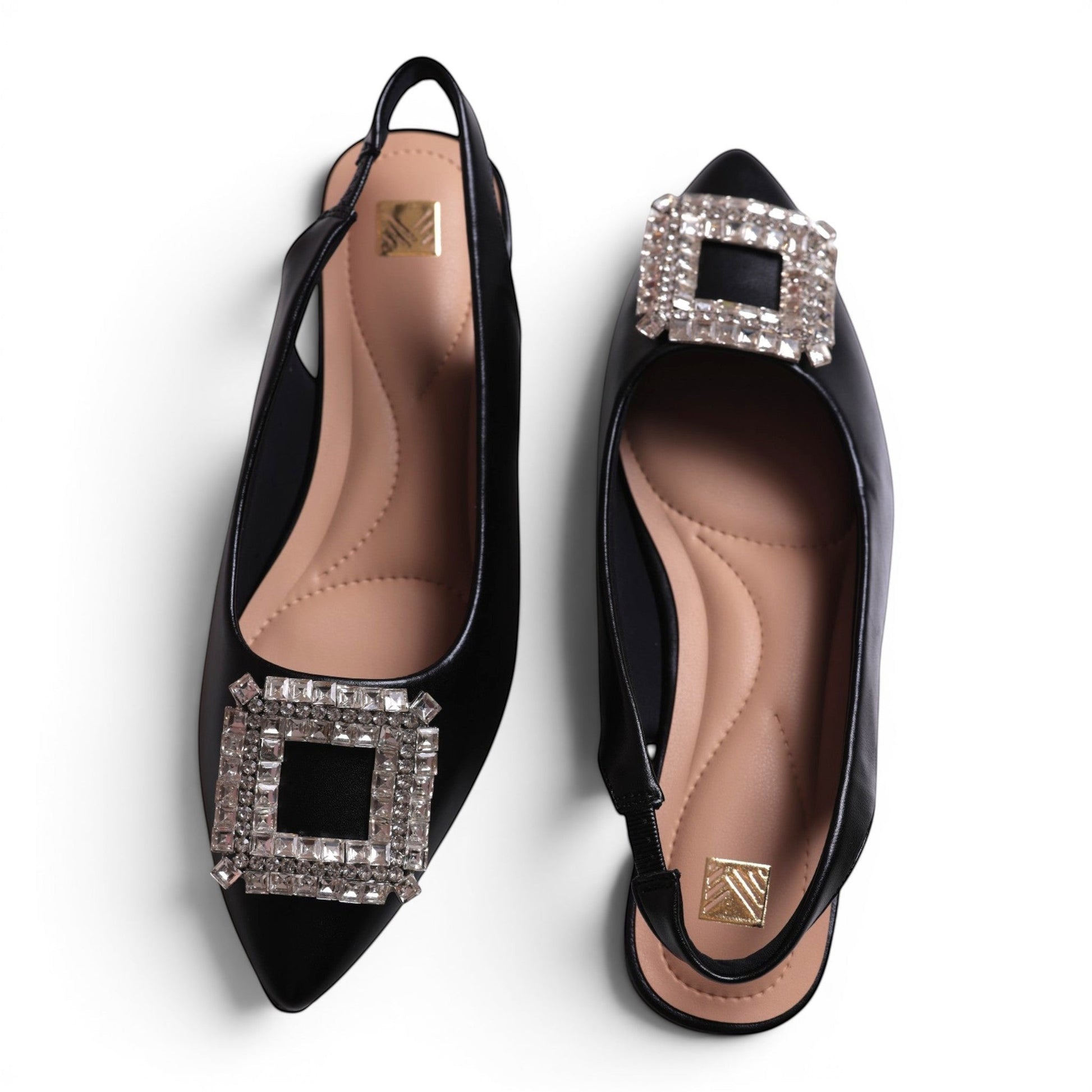 Moda Ug black pointed toe slingback flats with crystal square embellishments and cushioned insoles.