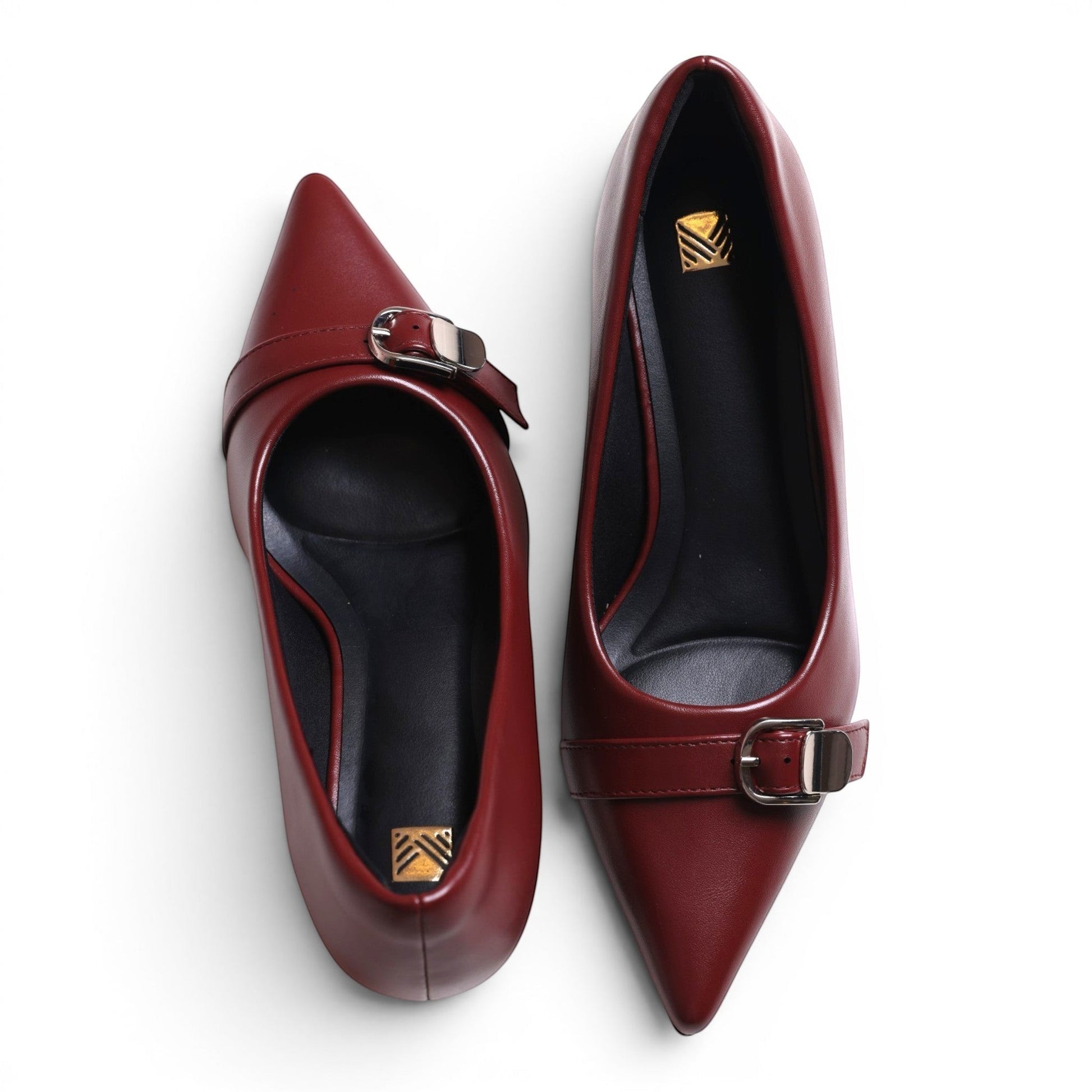 Moda Ug women's pointed-toe burgundy leather flats with buckle detail.