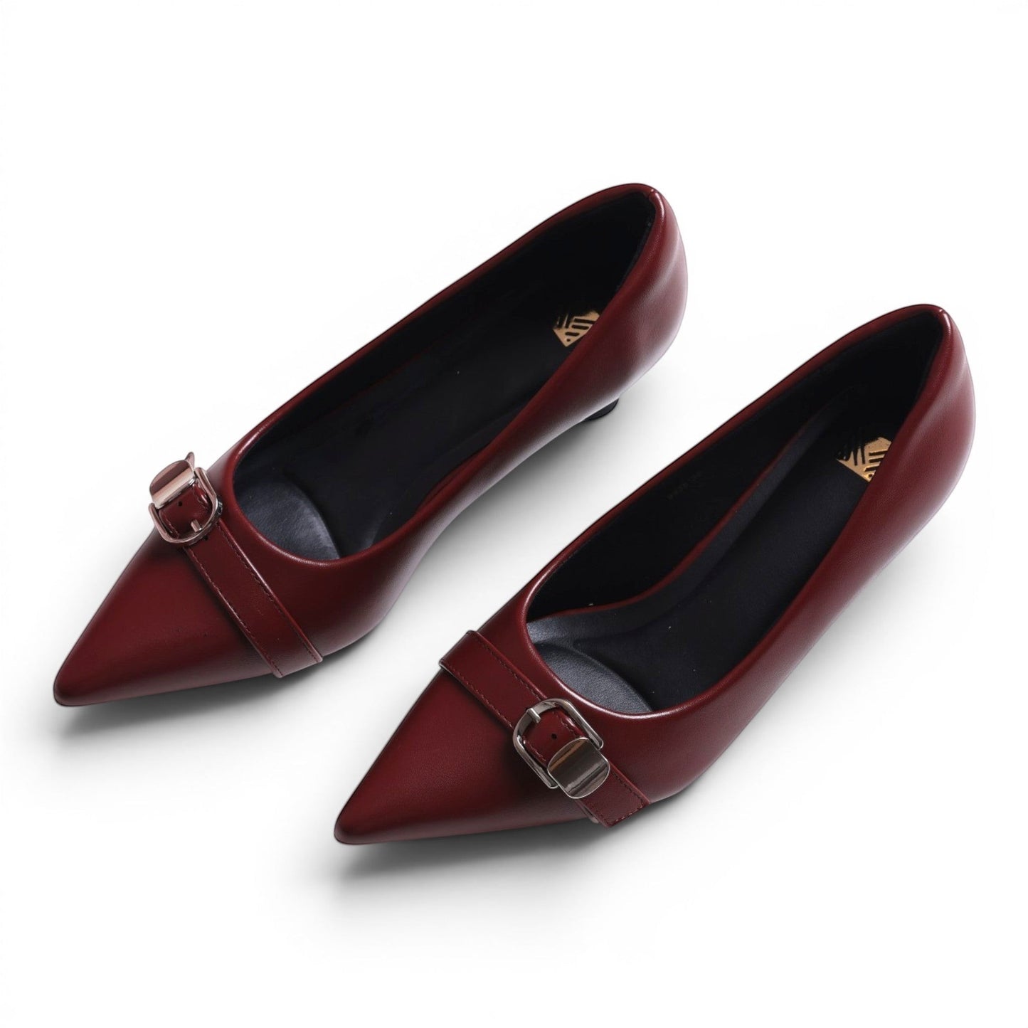 Moda Ug women's burgundy leather pointed-toe low-heel pumps with buckle detail.