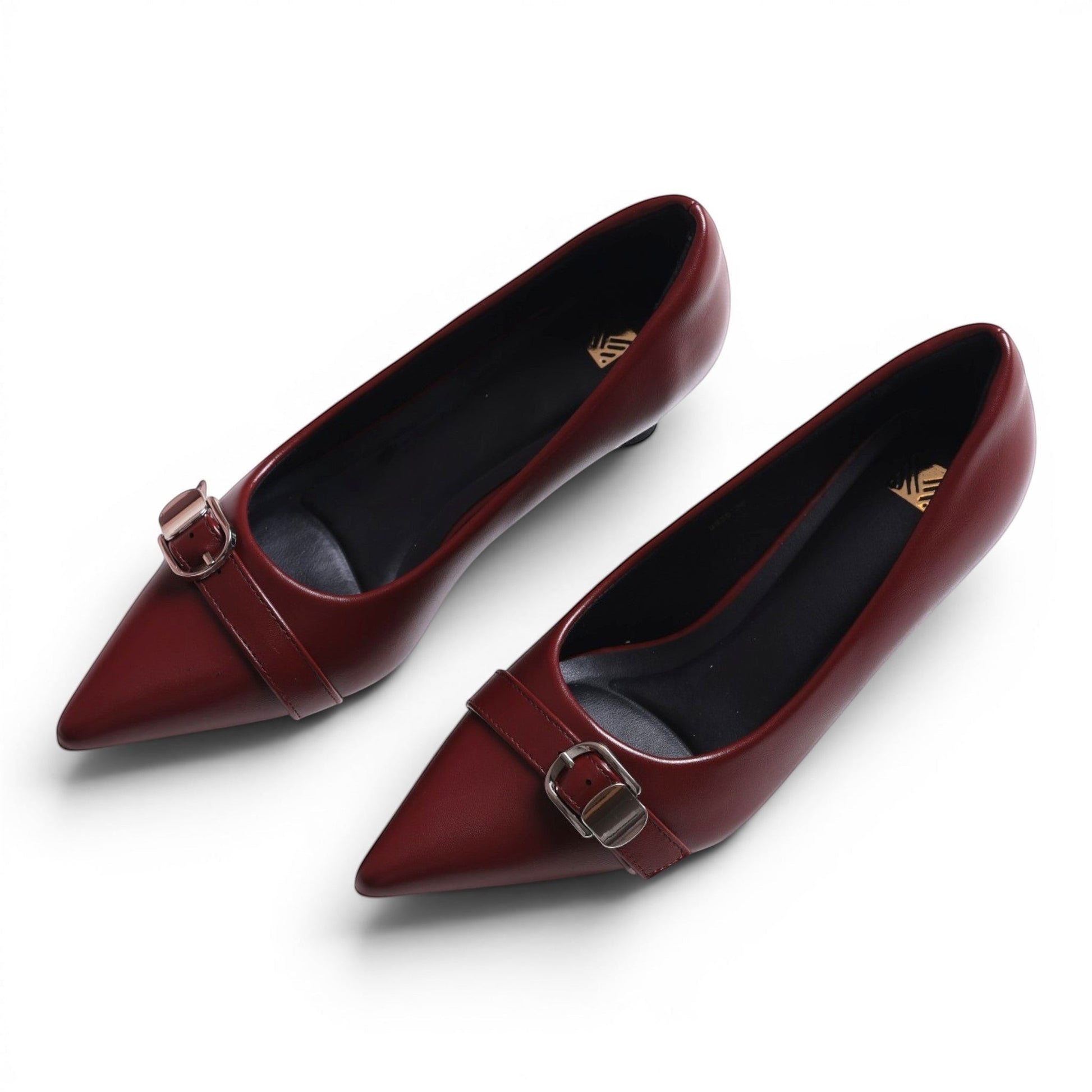 Moda Ug women's burgundy leather pointed-toe low-heel pumps with buckle detail.
