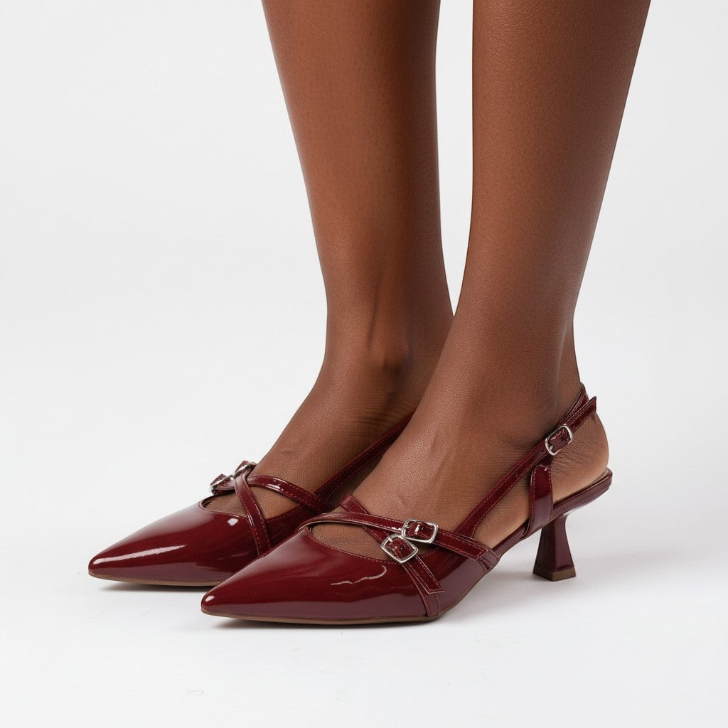 Moda Ug patent wine-red burgundy & black multi-strap slingback heels with pointed toe and silver buckles.
