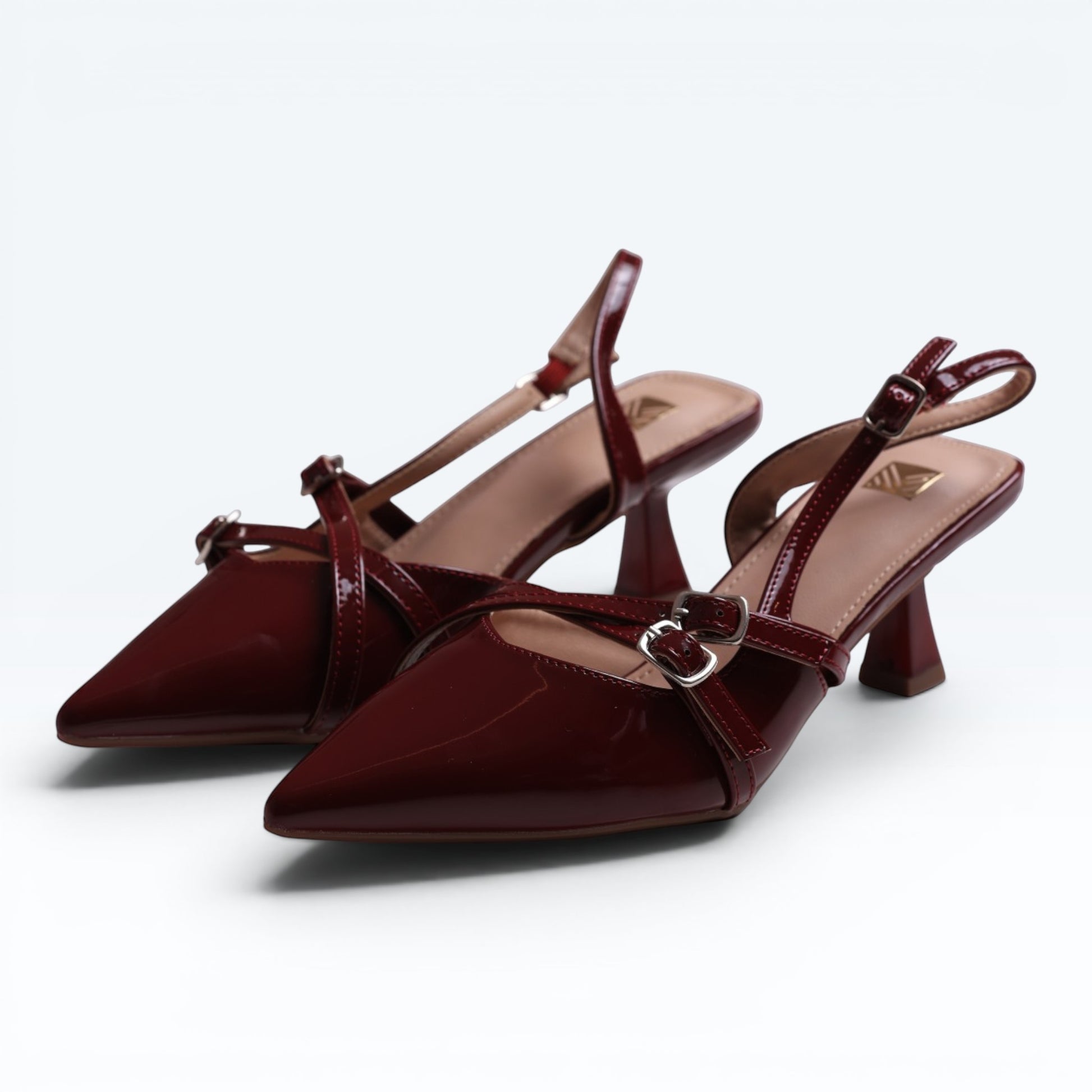 Moda Ug patent wine-red burgundy & black multi-strap slingback heels with pointed toe and silver buckles.