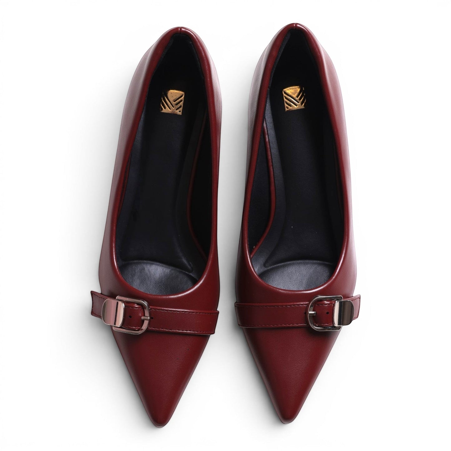 Moda Ug burgundy faux leather pointed toe kitten heel pumps with buckle strap detail.