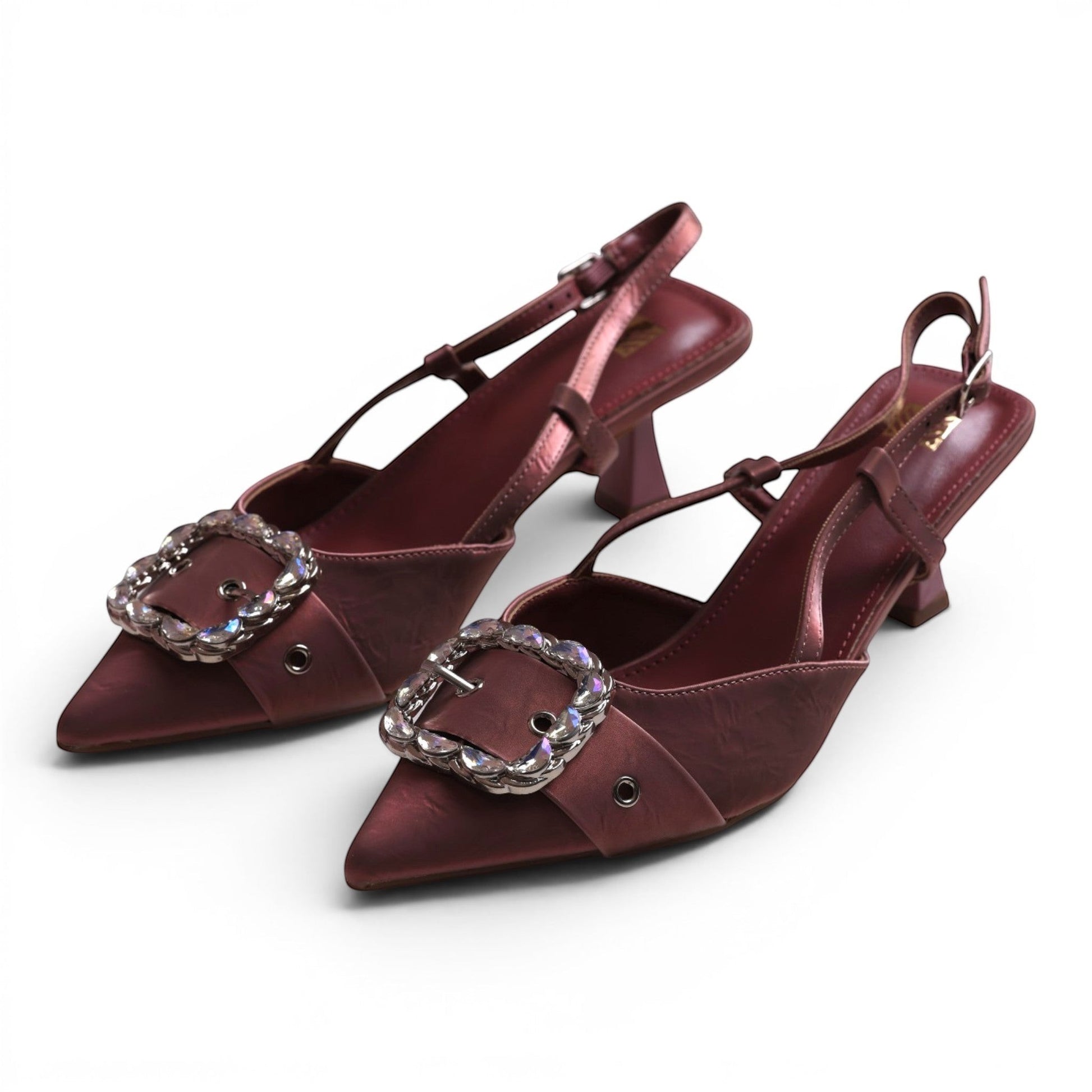 Moda Ug burgundy slingback heels with pointed toes, embellished buckles, and a flared heel.
