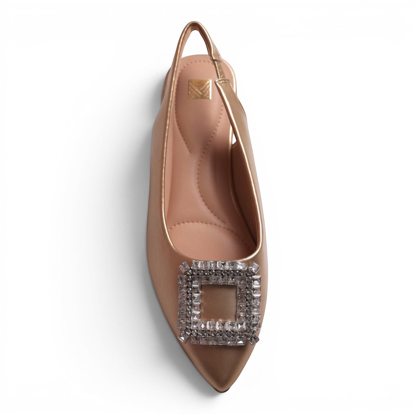 Moda Ug slingback flat shoe in champagne with a square crystal buckle and pointed toe.