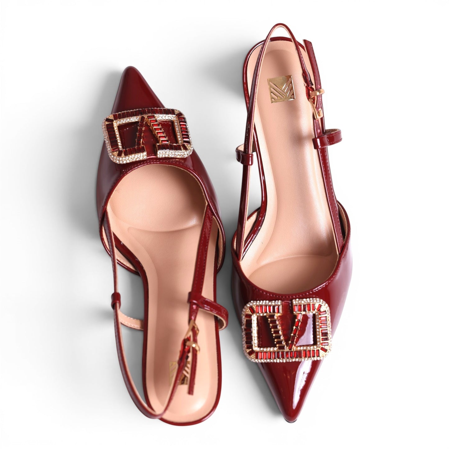 Moda Ug women's dark red patent leather slingback pointed-toe flats with decorative buckle detail.