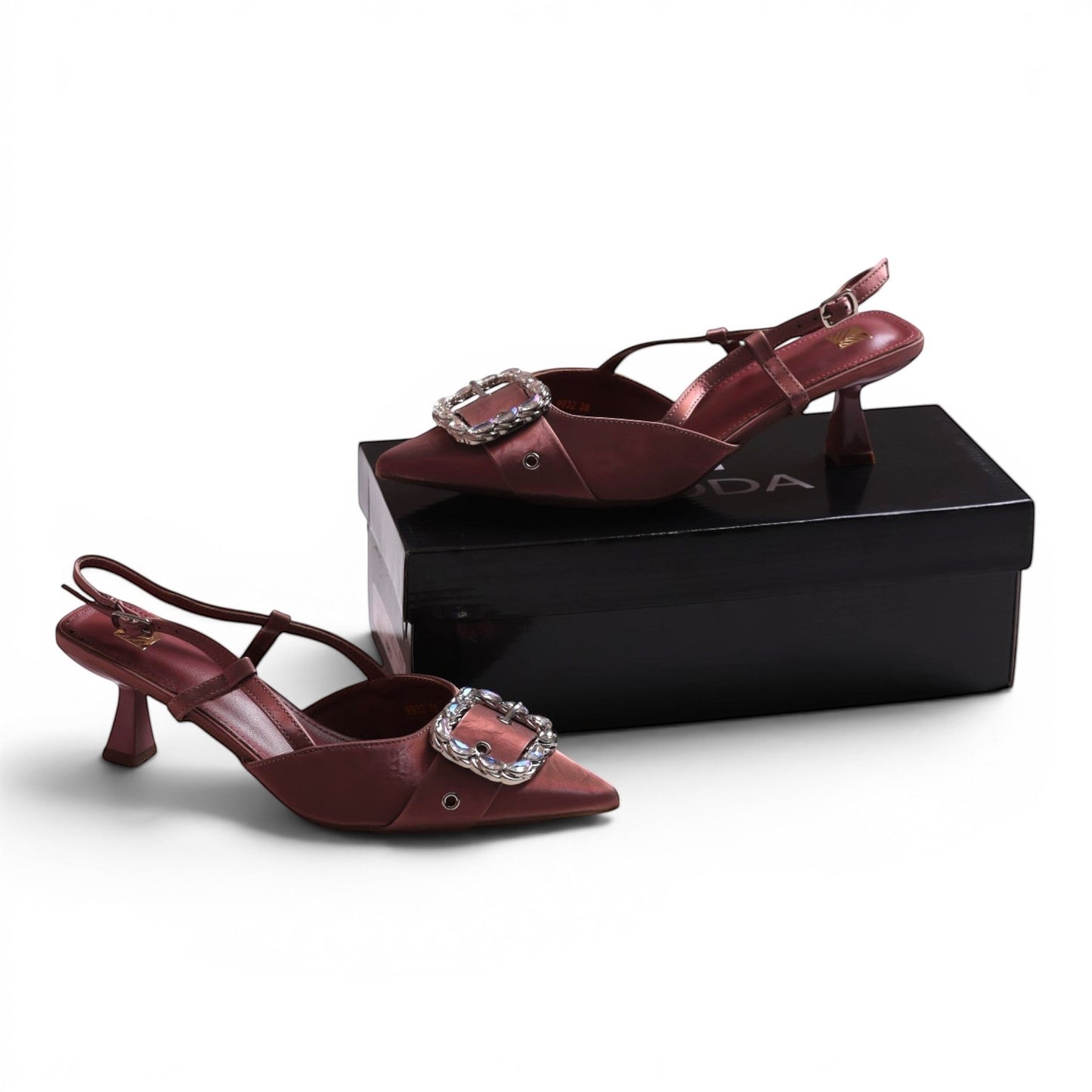 Moda Ug slingback heels in dusty rose satin with a pointed toe and a large crystal-embellished buckle.