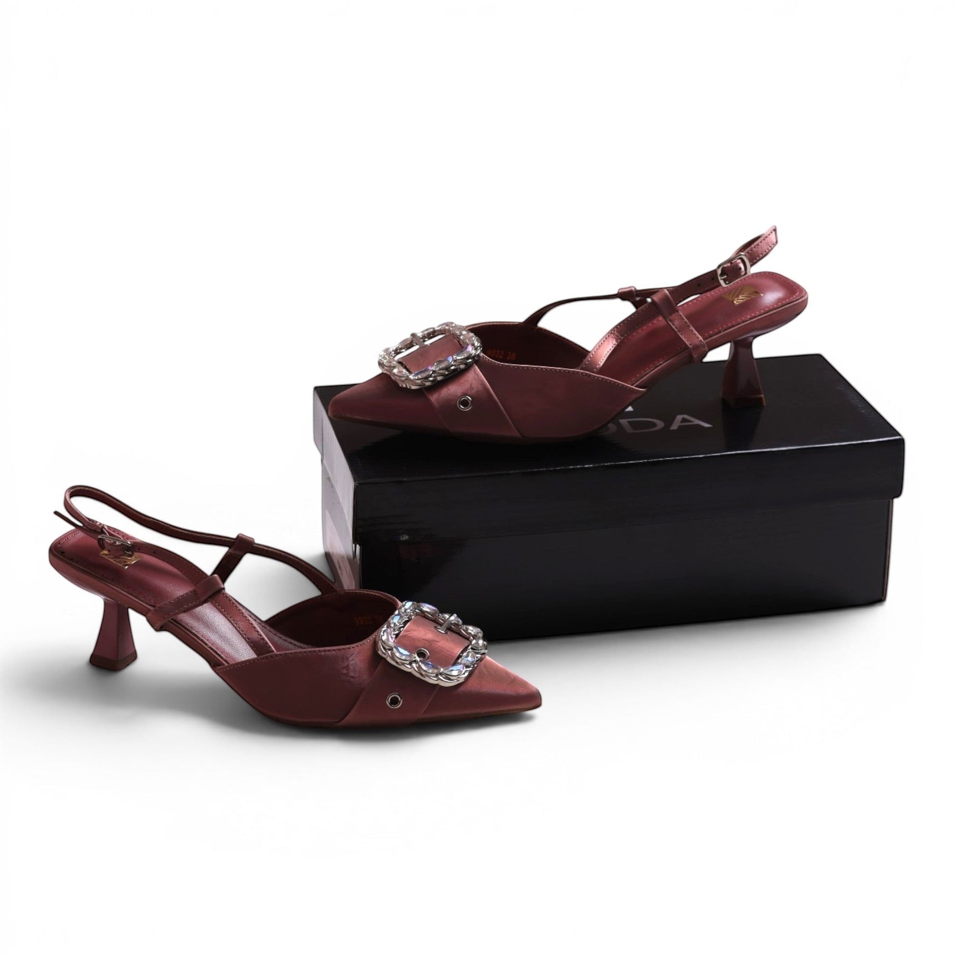 Moda Ug slingback heels in dusty rose satin with a pointed toe and a large crystal-embellished buckle.