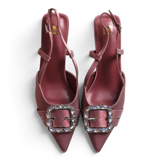 Moda Ug women's pointed-toe slingback heels in dusty rose with crystal-embellished buckles and adjustable ankle straps.
