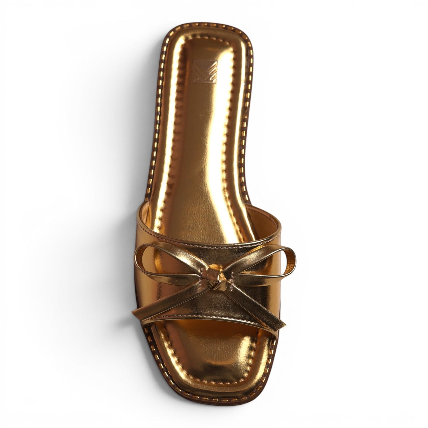 Moda Ug gold metallic slide sandals with a bow detail and square toe. Women's slip-on shoe.