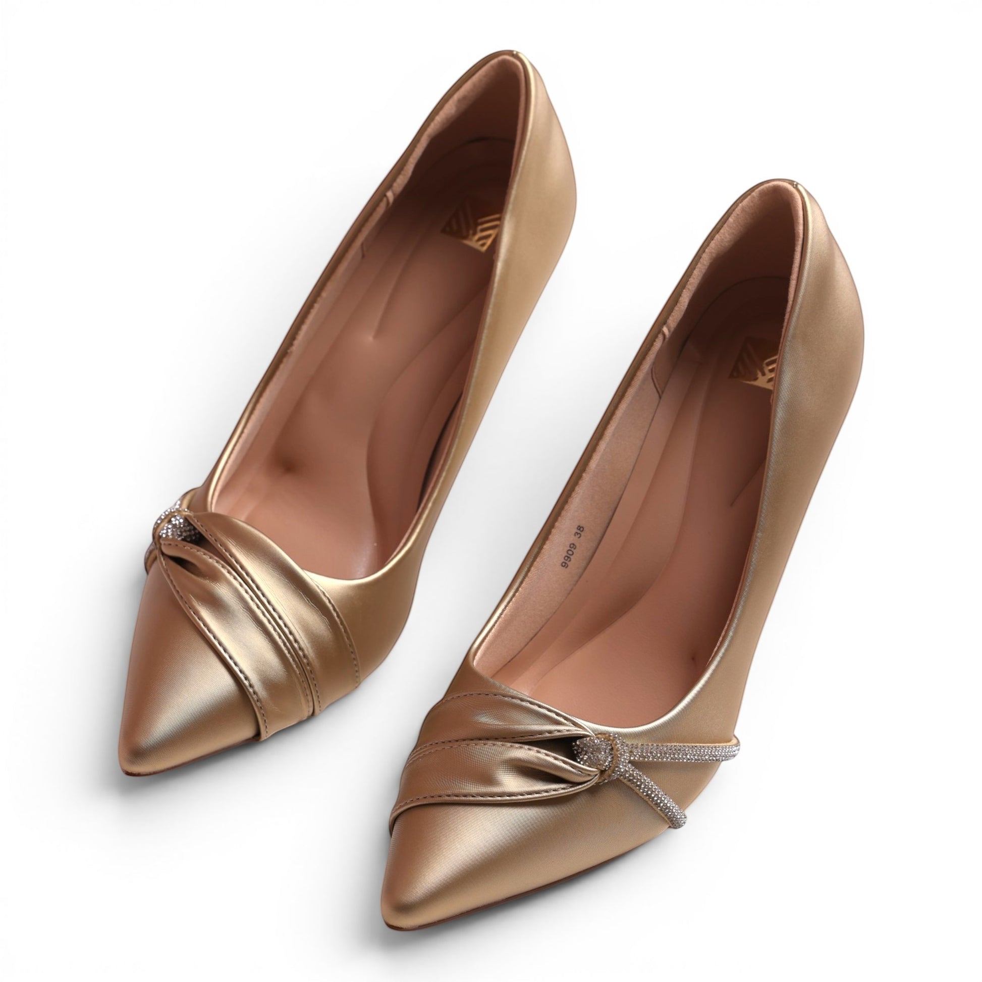 Moda Ug gold satin stiletto heels with pointed toe, knotted detail, and rhinestone embellishments.