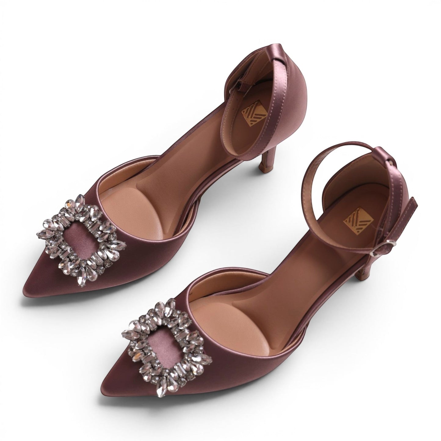 Moda Ug women's mauve satin pointed-toe kitten heel pumps with ankle strap and crystal embellishment.