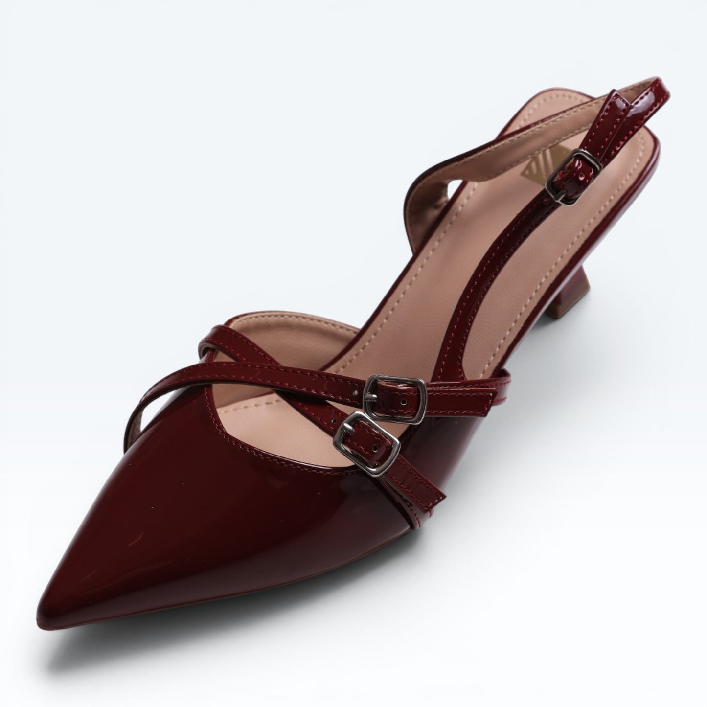 Moda Ug patent wine-red burgundy & black pointed-toe slingback heels with multi-strap design and silver buckles.