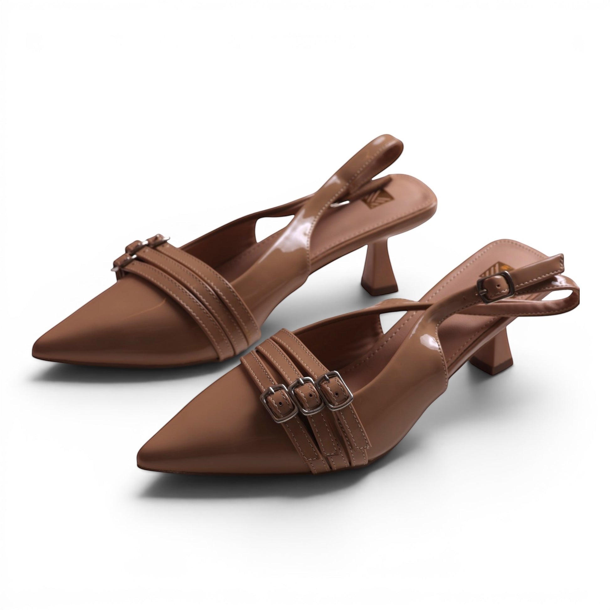 Moda Ug patent leather slingback kitten heel dress shoes in nude with pointed toe and triple strap detail.