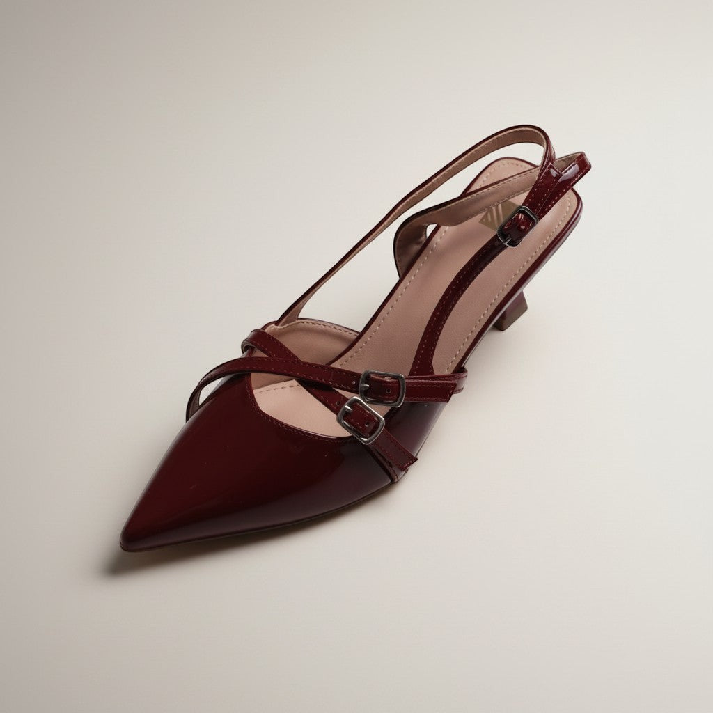 Moda Ug patent leather slingback heels in deep red with criss-cross straps and buckle detail.