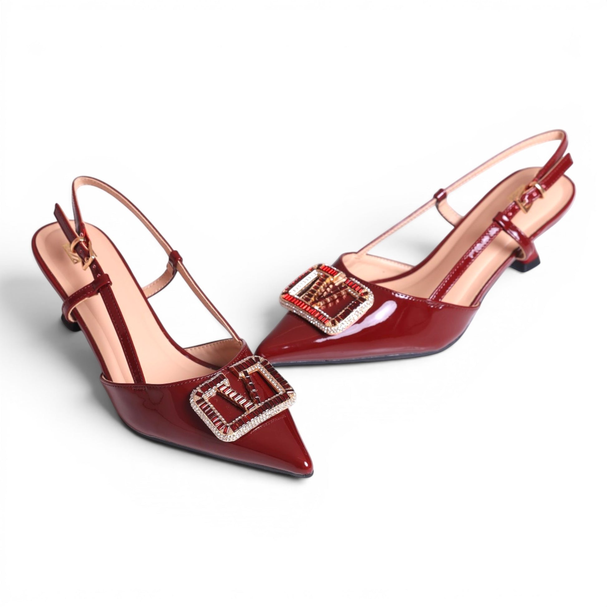 Moda Ug women's patent leather slingback heels in deep red with crystal-embellished buckles and pointed toes.