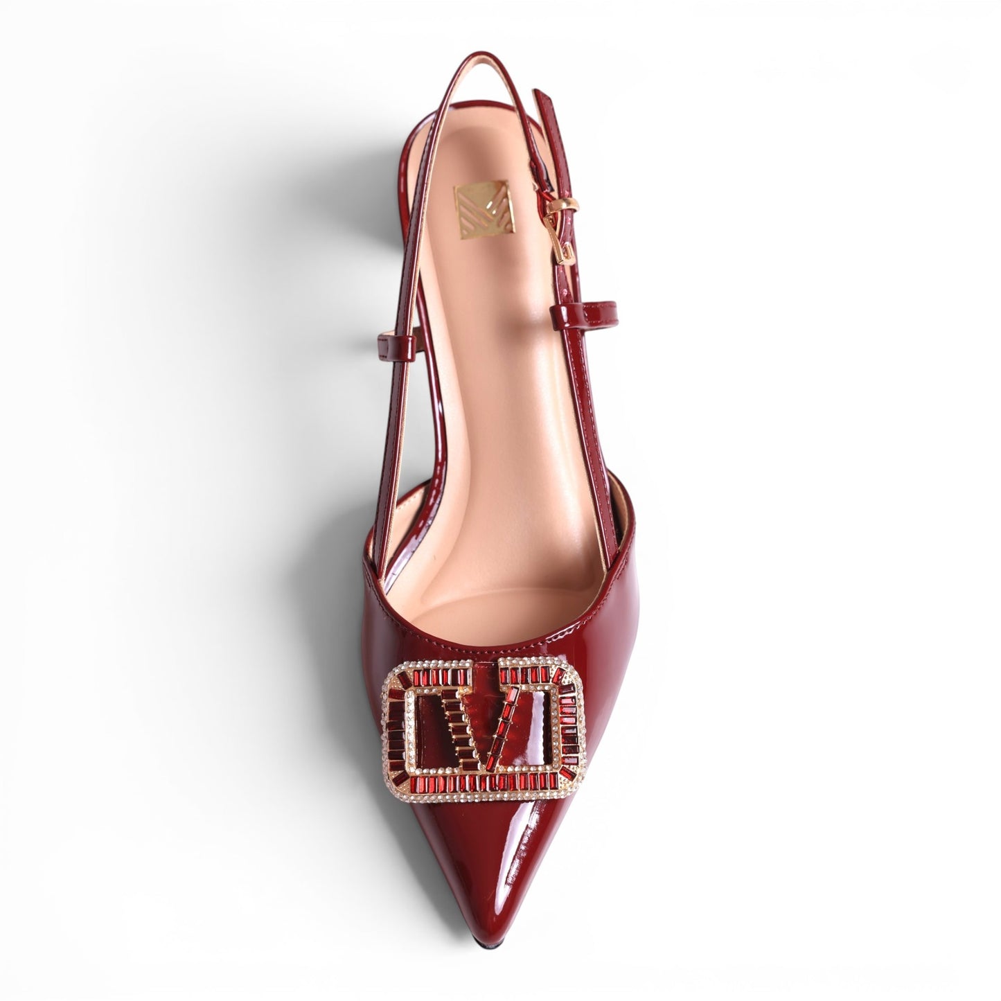 Moda Ug patent leather slingback heels in deep red with a decorative V-shaped buckle embellished with red and clear crystals.