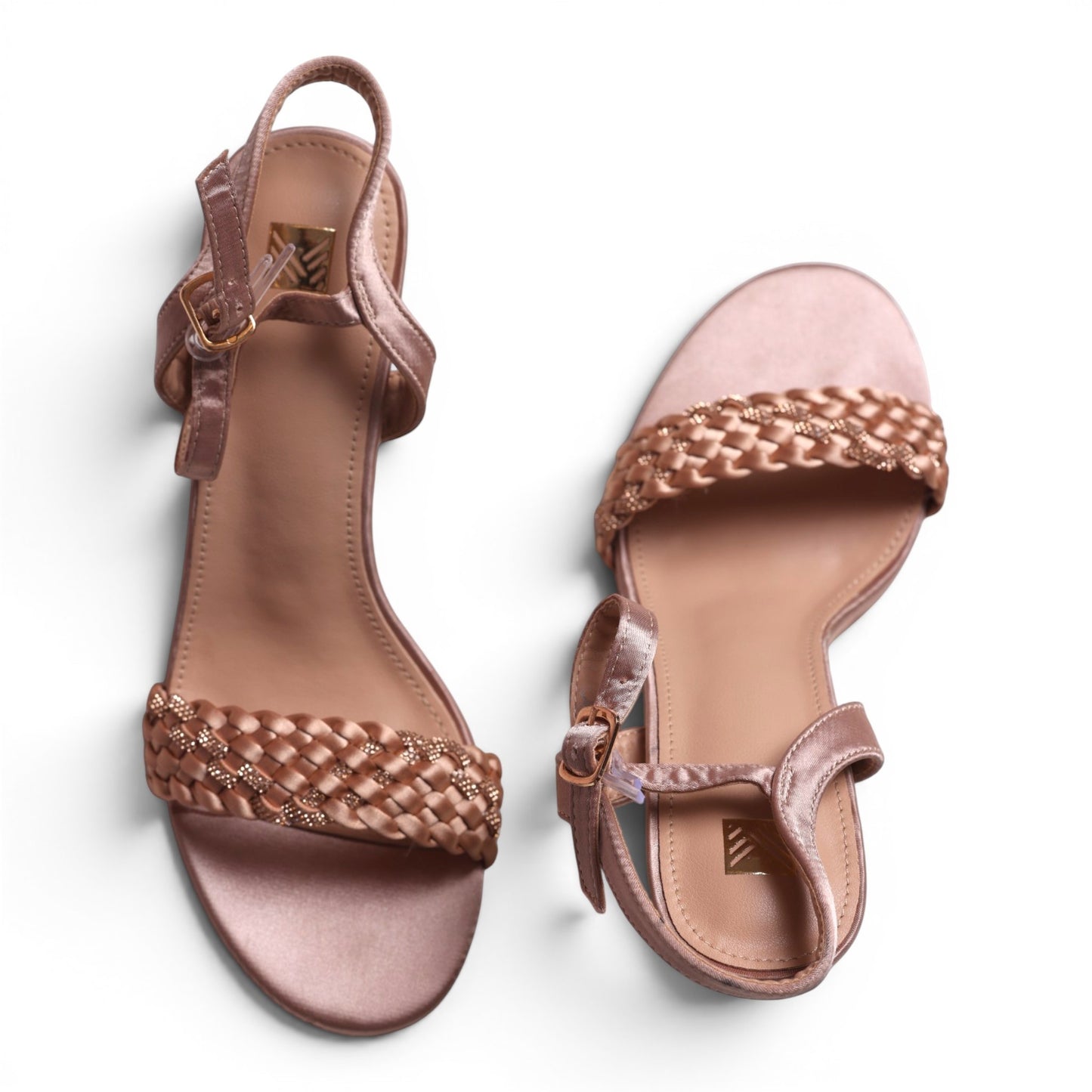 Moda Ug rose gold braided strap heeled sandals with ankle strap and buckle closure.