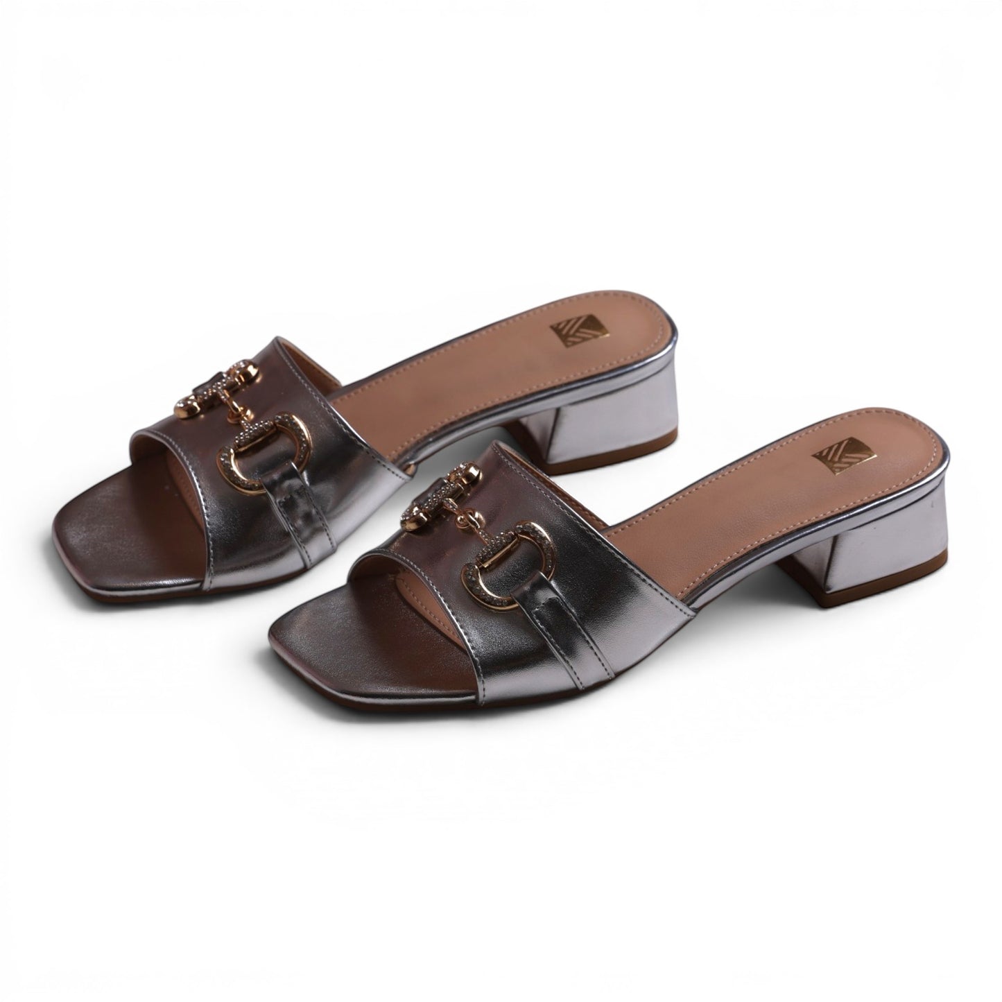 Moda Ug silver metallic slip-on block heel sandals with gold horsebit detail and square toe.