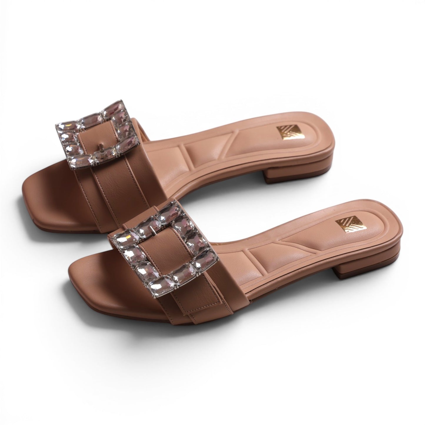 Moda Ug women's tan square-toe slide sandals with crystal embellished buckle detail.