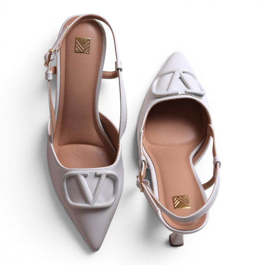 Moda Ug white leather slingback heels with V logo detail and pointed toe. Adjustable ankle strap.