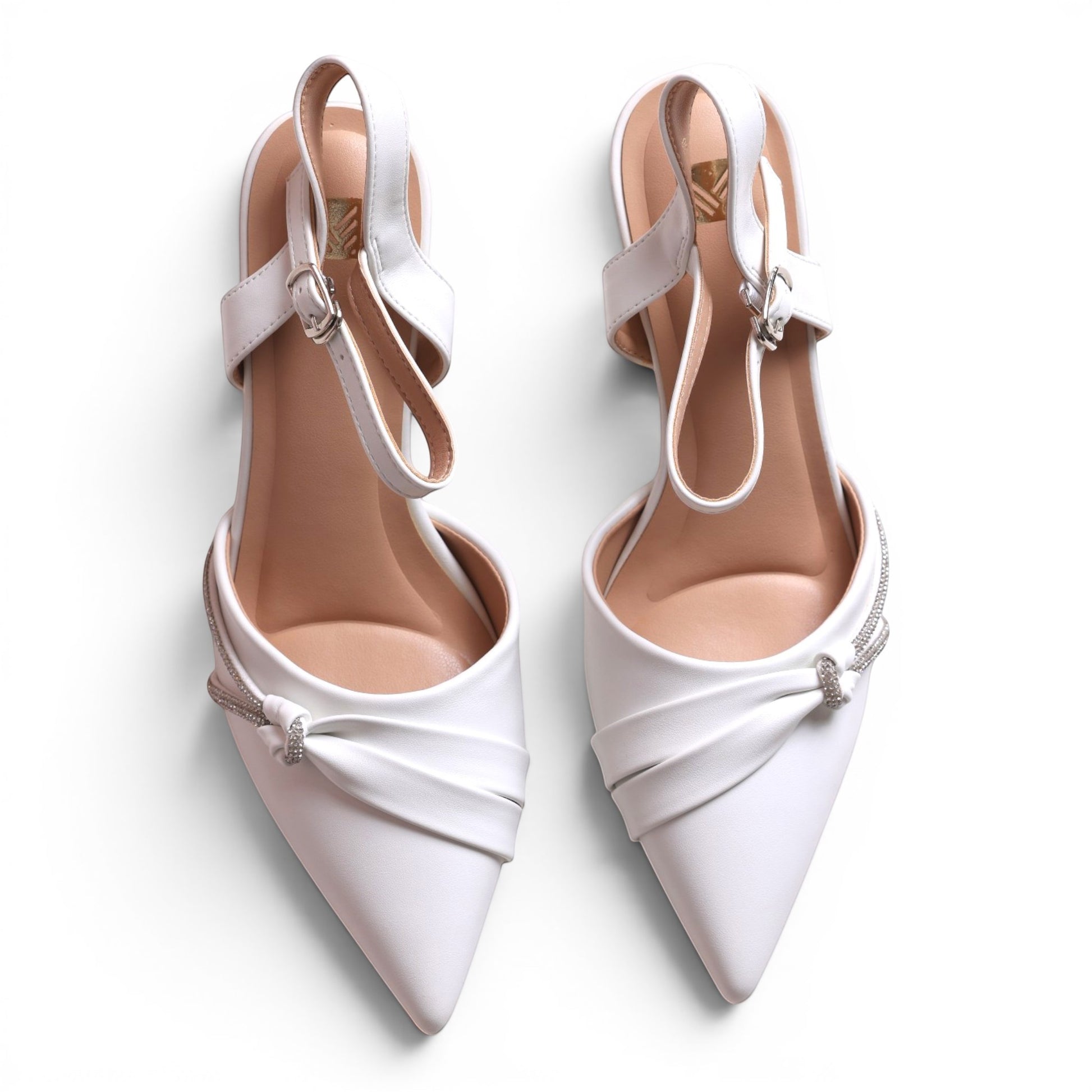 Moda Ug Women's white faux leather pointed toe heels with ankle strap and rhinestone embellishment.