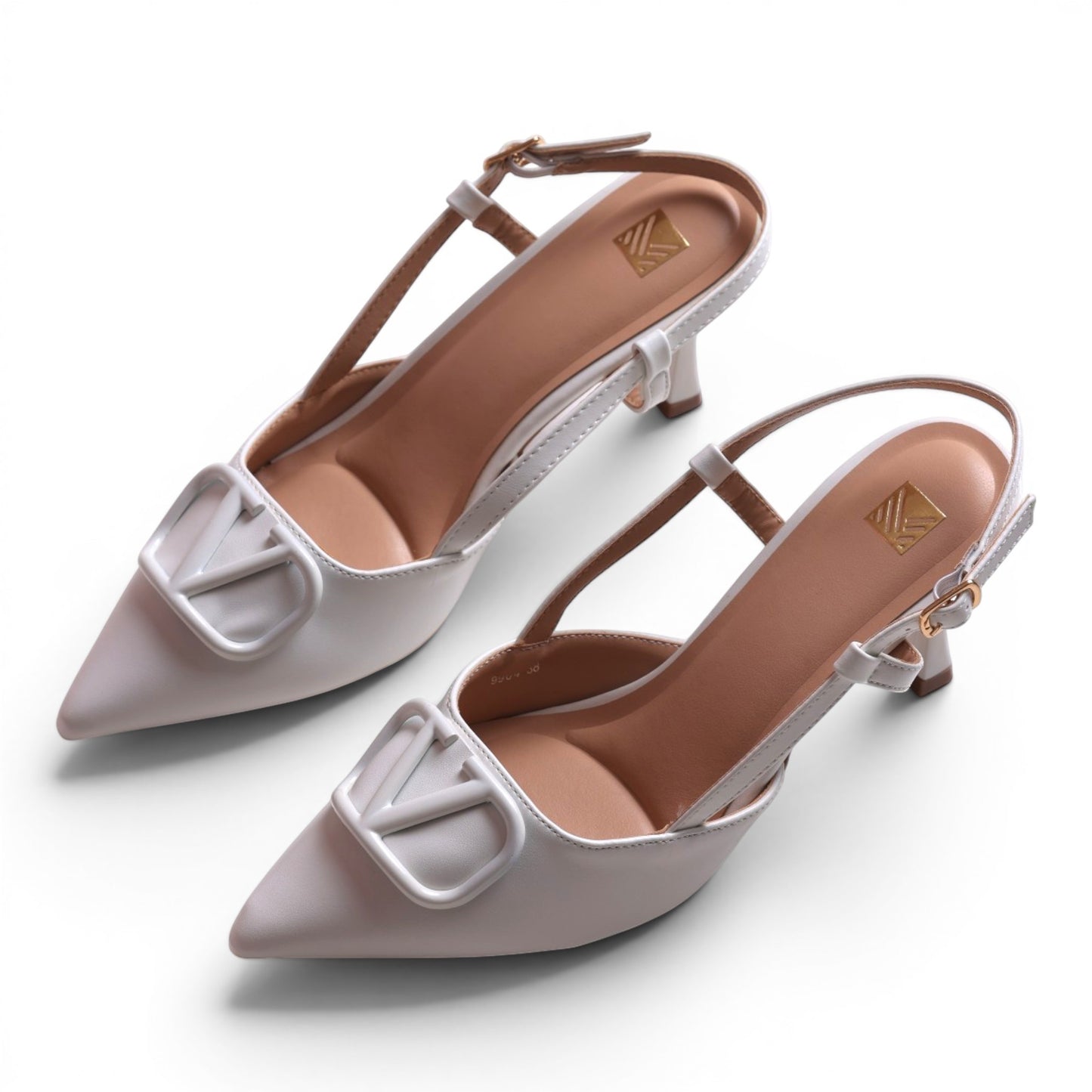 Moda Ug white slingback heels with pointed toe and decorative V-shaped buckle detail.