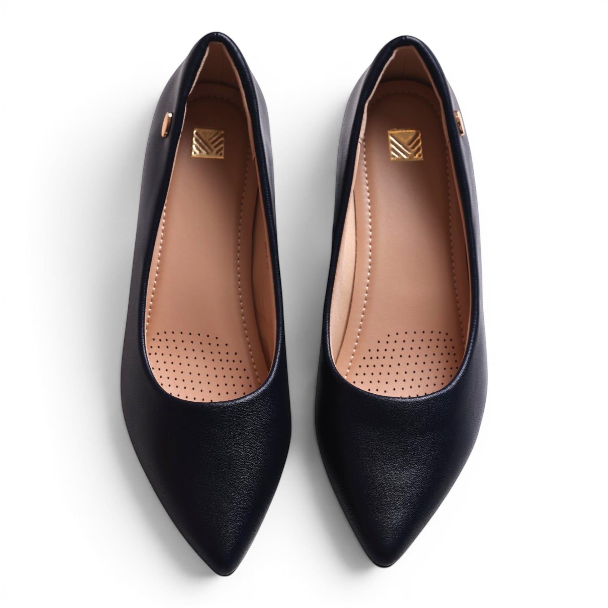 Moda Ugo navy blue pointed-toe ballet flats with gold emblem detail.